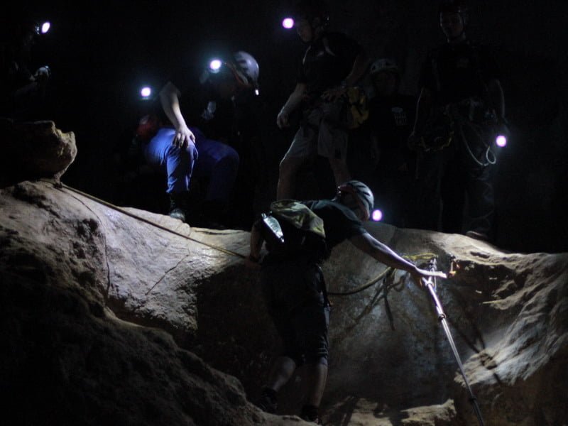 5. participants abseil within the cave