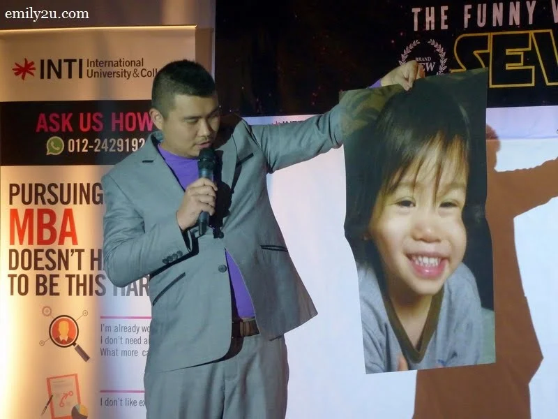 3. Phoon Chi Ho with a poster of his 3-year-old son, Tristan