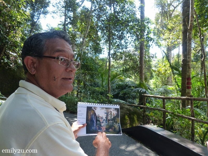 17. Operations Manager Andrew Stevenson holds a copy of the painting of the hill from years ago - the original painting is currently being displayed in Singapore