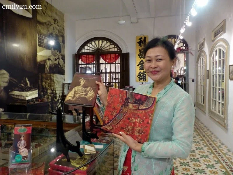 22. Nyonya Lillian Tong, Museum Director of Pinang Peranakan Mansion, with her two published books on Peranakan culture and tradition