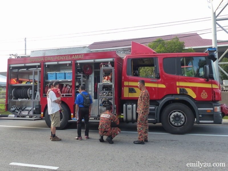 3. a young family checks out a fire engine