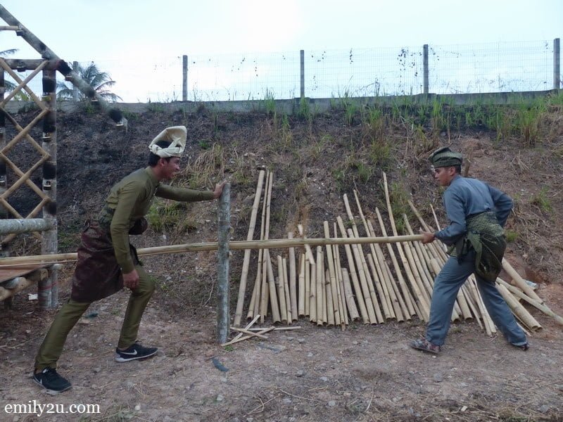1. two 'Malay warriors' prepare bamboo for Pesta Panjut
