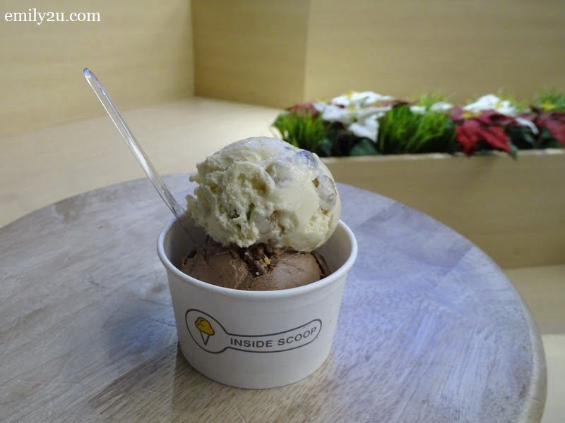 a scoop of Nutty Nutella topped with a scoop of Rum & Raisin
