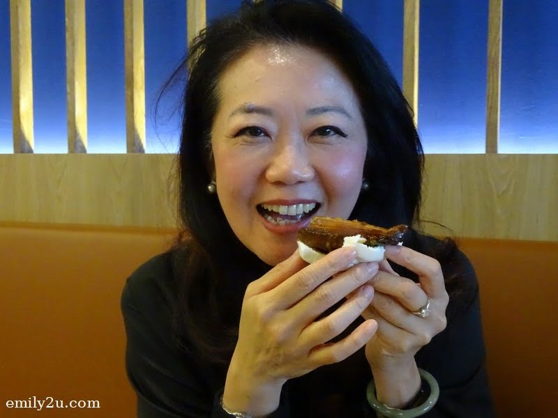 8. Ms. Katherine Chew (Resorts World Genting Vice President Resort Communications & Public Relations) about to savour her mantou with pork belly and yam