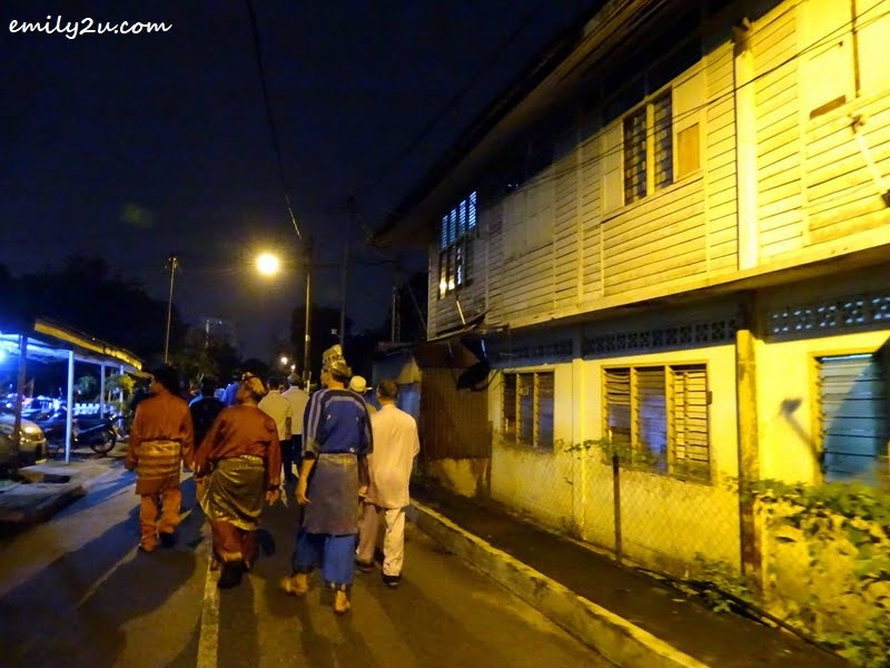 5. walking along the alley in traditional costumes