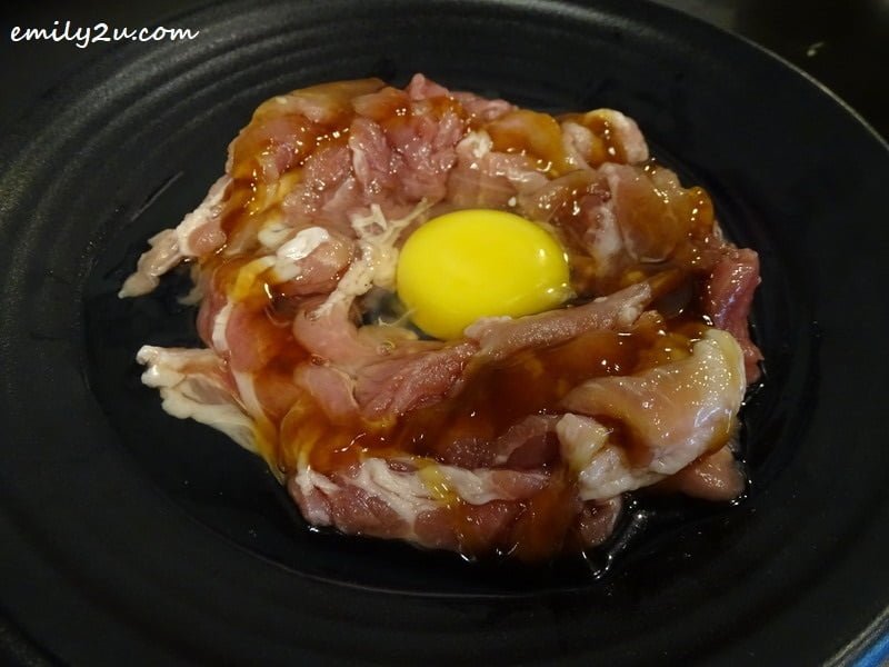 3. sliced pork with sirloin topped with a raw egg