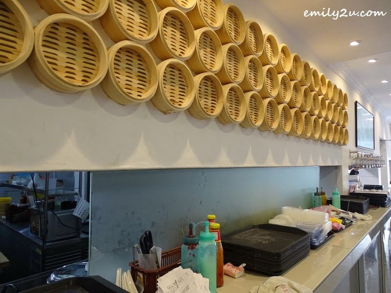 3. bamboo steamer baskets line the wall