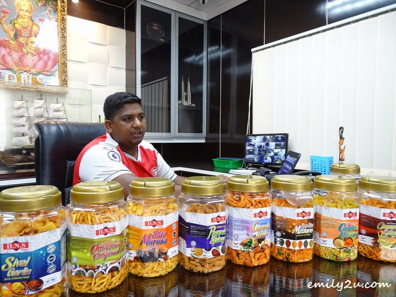 3. Neru at his office with 8 types of kacang putih, with the most popular from left to right