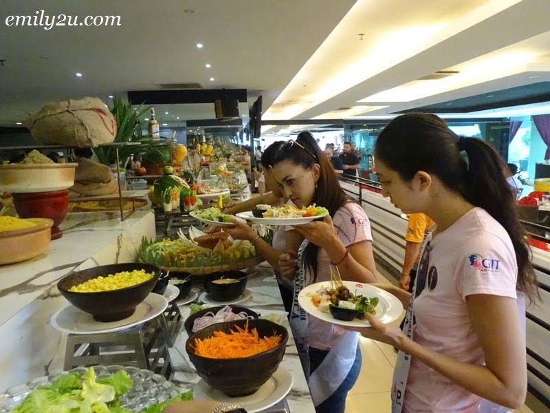 6. Miss Cosmopolitan World (MCW) 2018 Finalists getting their lunch from the buffet line