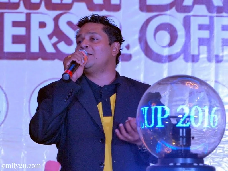 10. emcee Reuben Nagarajan entertains guests with his rendition