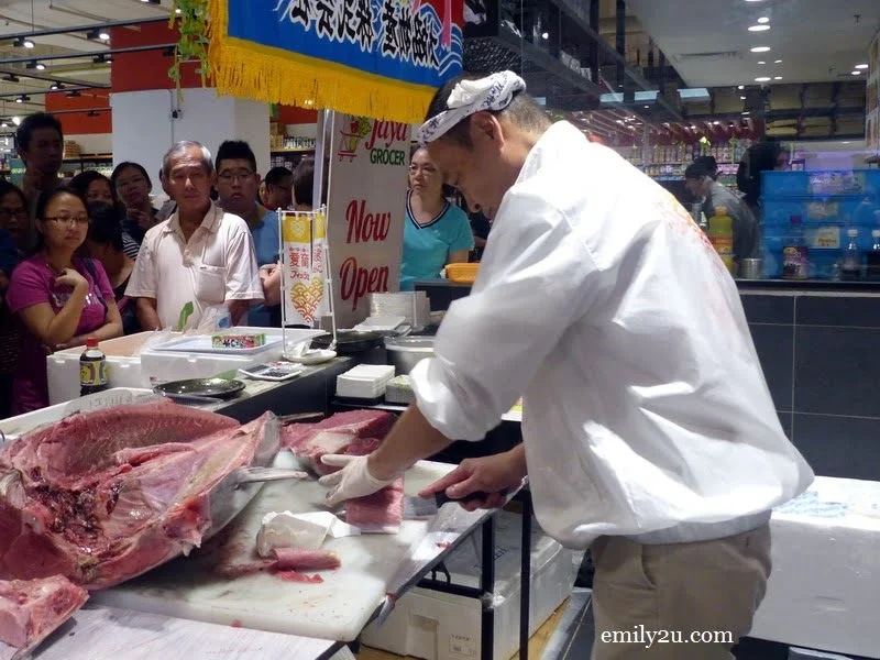 2. the bluefin tuna is being sliced