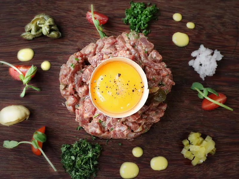 one of the 21 dishes - Brussels Sprouts + Steak Tartare