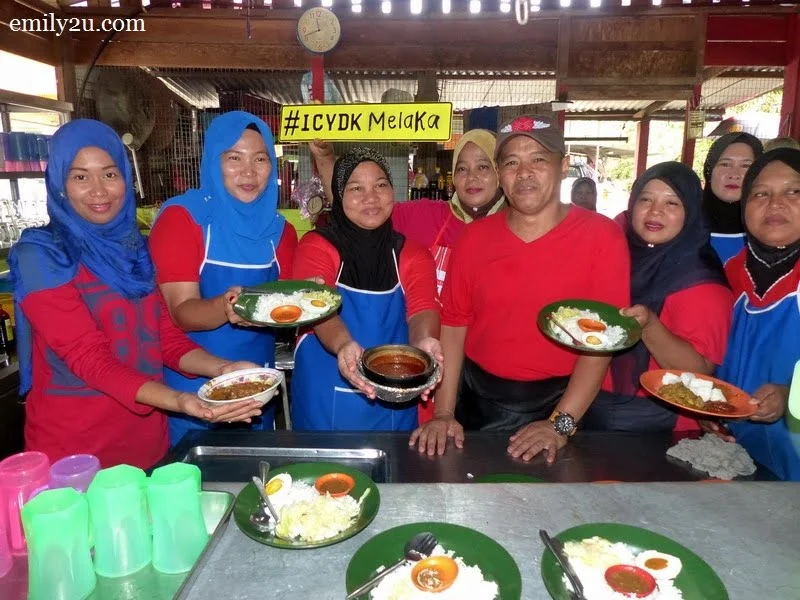 7. Yusri Nadin with his staff and food