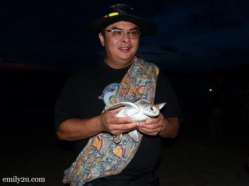 19. Phil and his turtle before it is released