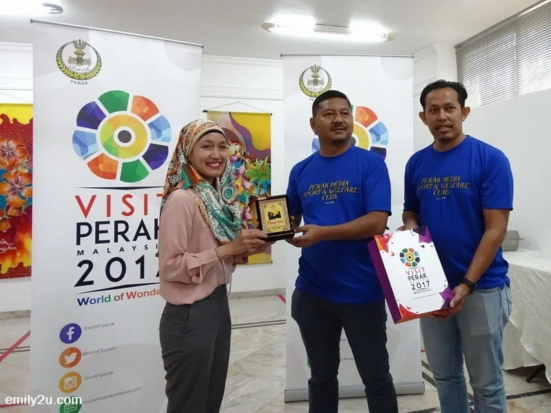 6. presenting a club memento to Ms. Mega