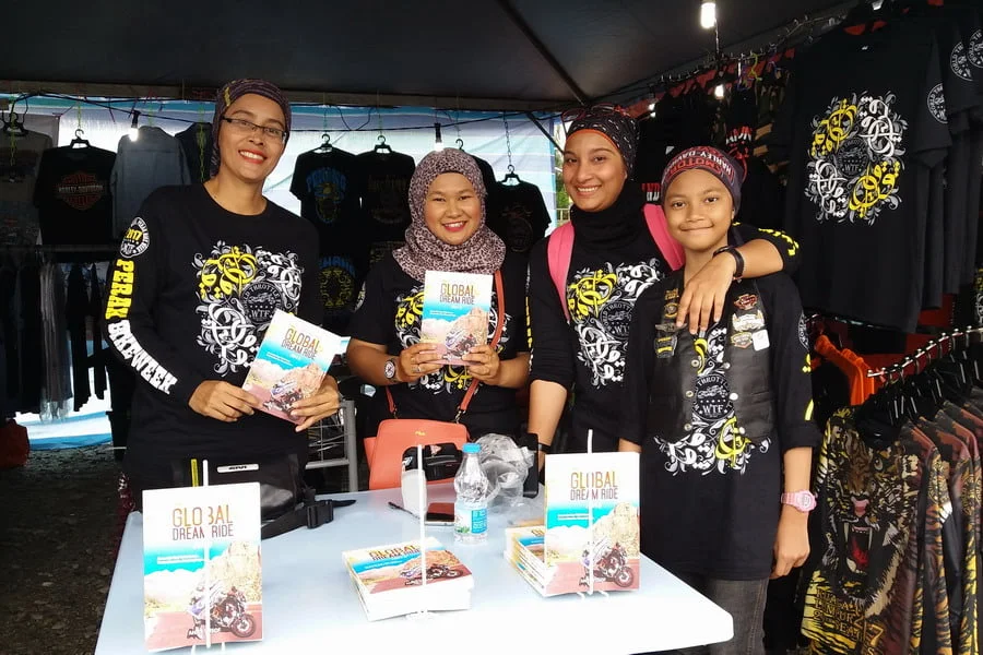 12. World Solo Rider Anita Yusoff (L) promotes her book