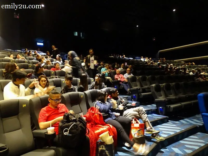 6. the cinema is filling up with invited guests