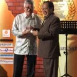 Peter Chan receives one of two awards from Deputy Minister of International Trade and Industry