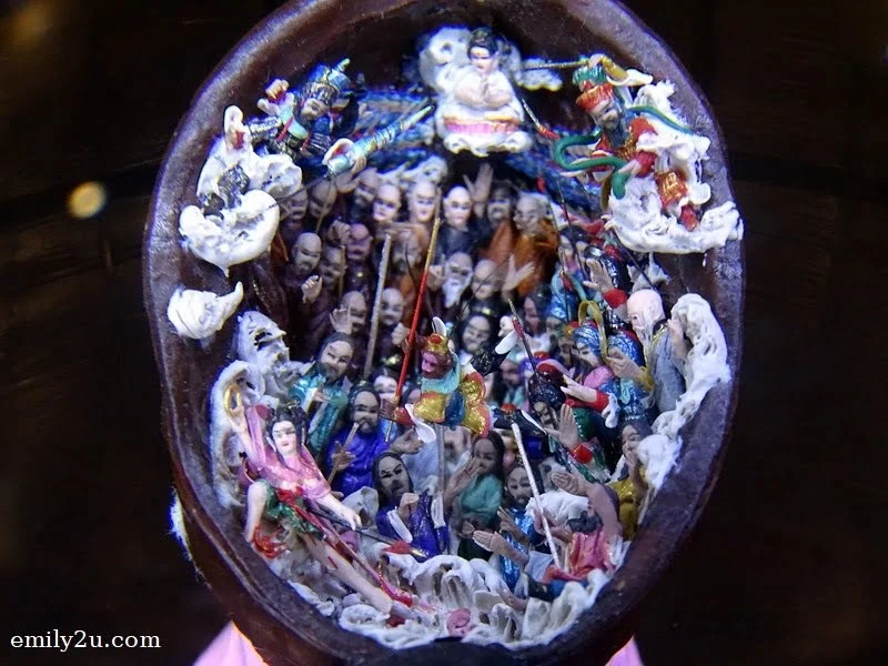 13. this walnut shell contains 100 tiny dough figurines which tell the story of the Monkey King causing havoc in the Heavenly Palace