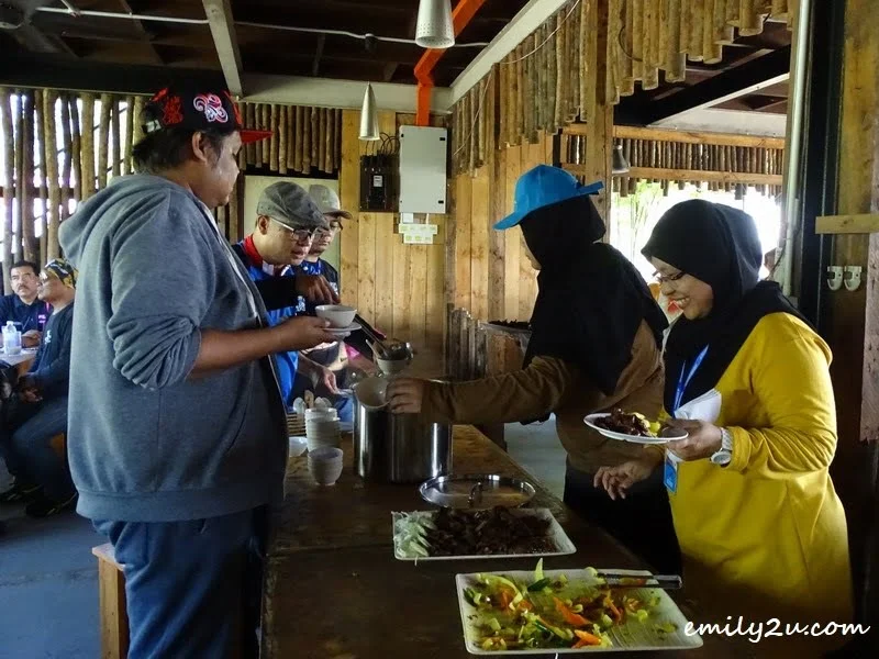 12. helping themselves to a lunch of lamb 