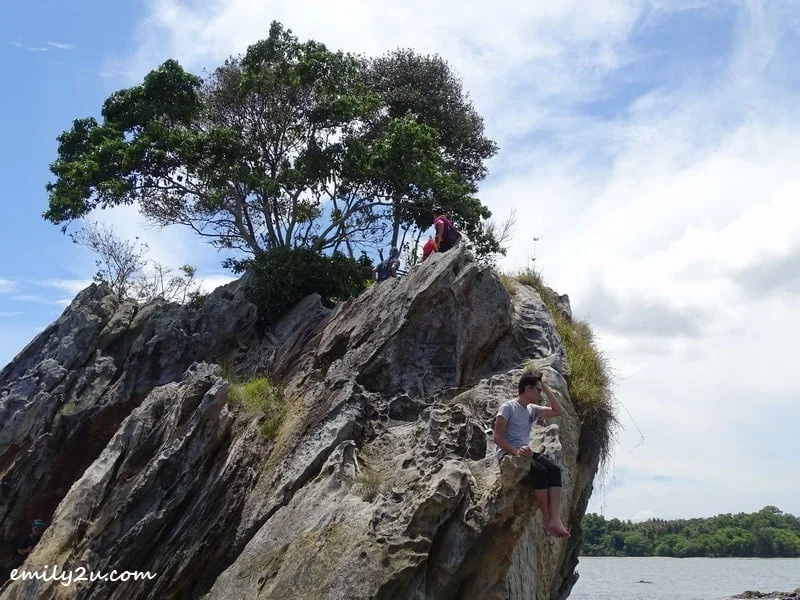 12. Hasif sits on the edge of the cliff