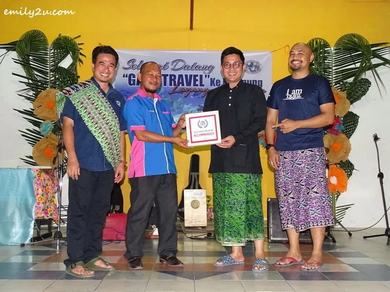 17. Ketua Kampung Layang-Layangan En. Faizal Bin Hj. Lakat (2nd from L) receives an appreciation plaque from Gaya Travel Magazine, represented by Nuar Md. Diah (2nd from R) and Ed Junaidi (R), as Director of Tourism, Cultural and Arts Department of Labuan Corporation, En. Mahathir Hamid (L) looks on