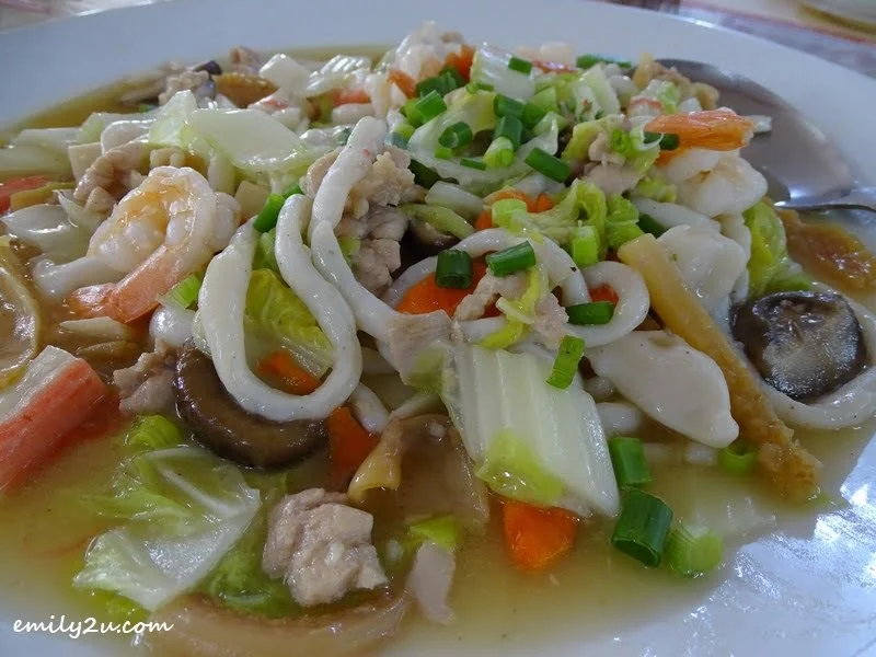 2. handmade fish noodles braised in an assortment of ingredients, including mushroom, prawns, crab stick and, baby corn