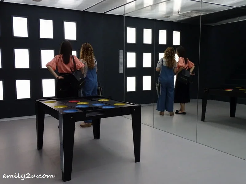  10. two visitors observe the Hollow Face Illusion