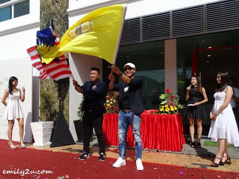 14. waving the flags of Malaysia and BAISI International