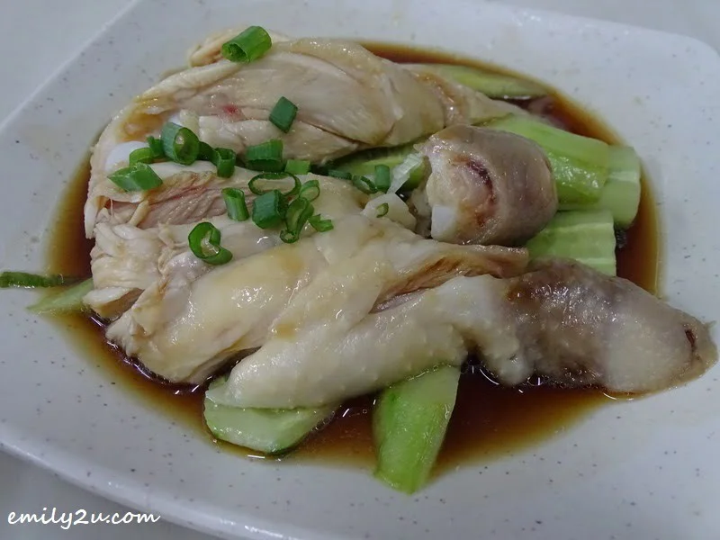 4. chicken for one pax on a bed of sliced cucumbers and garnished with chopped spring onions