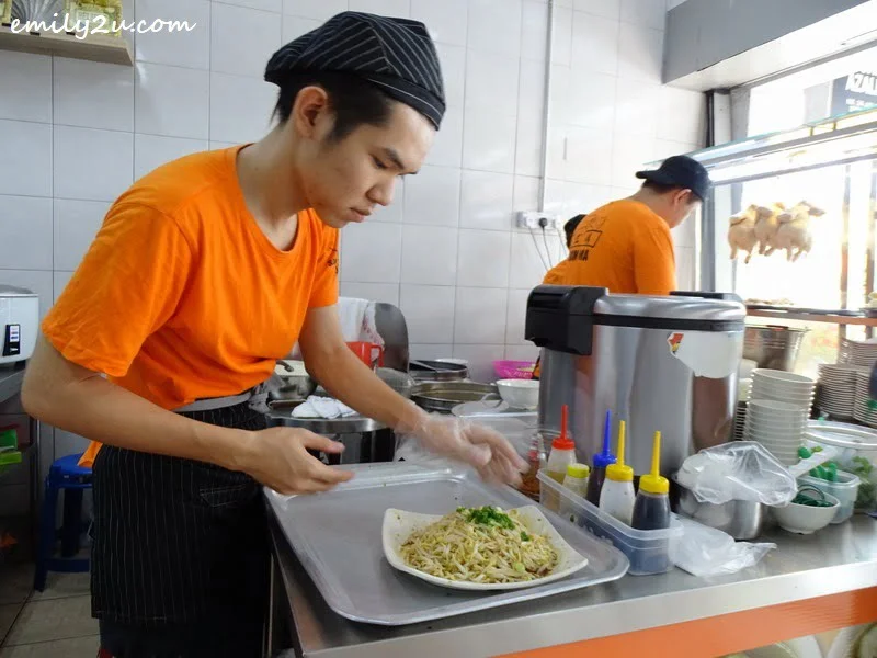 7. a platter of bean sprouts being prepared