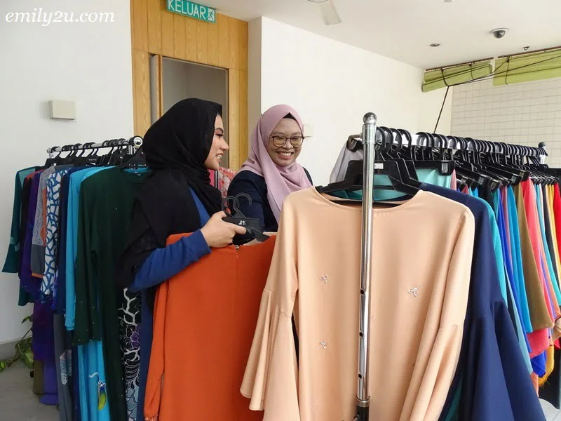 11. customers browsing through the apparel offered by Ektira