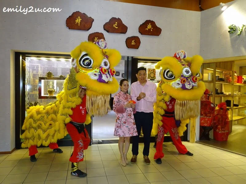 7. Mr Andy Yan and Ms Elena Phor in front of their specialty tea store