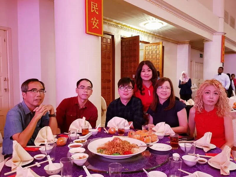 8. Syeun Hotel's Ms Maggie Ong (standing), with regular guests, Mr. Cheong and his family