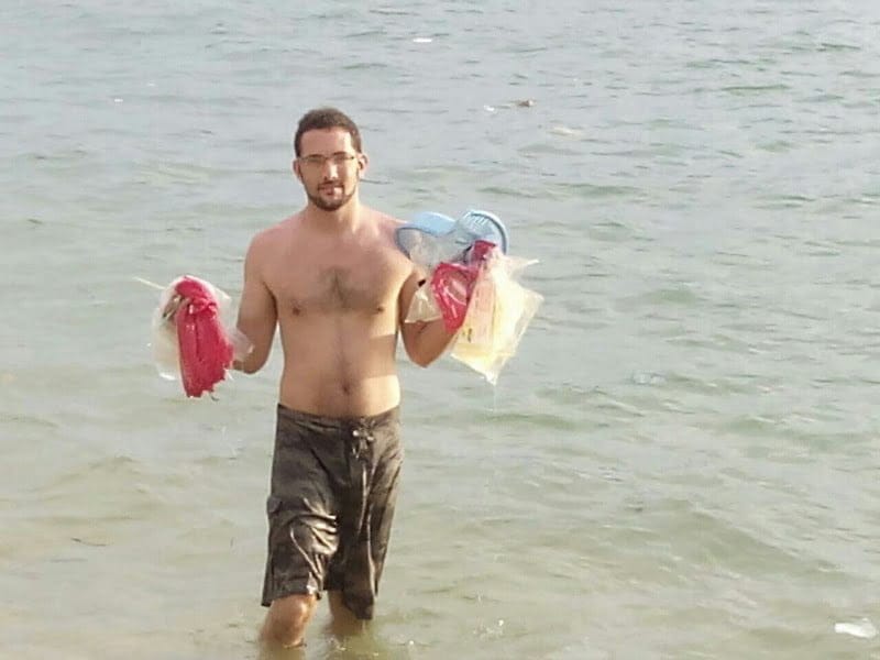 picking up trash from the ocean. off Pangkor island