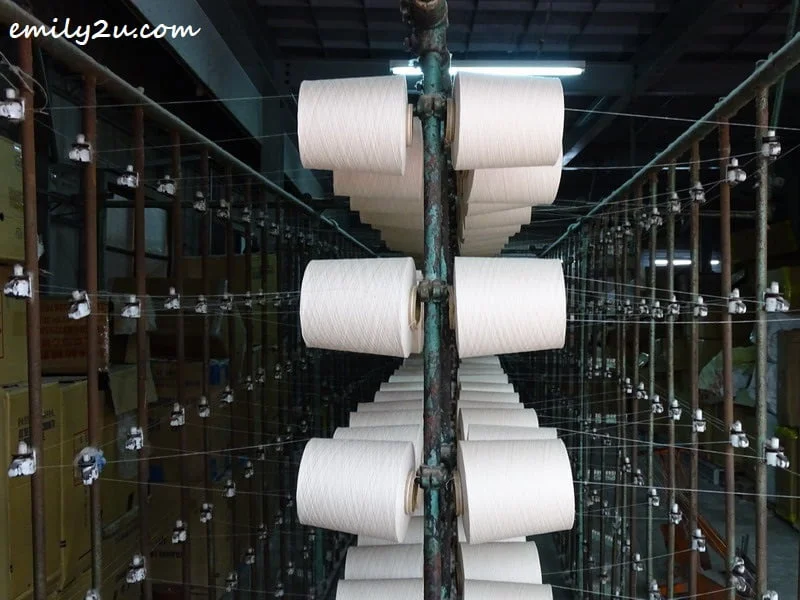 spools of thread being spun