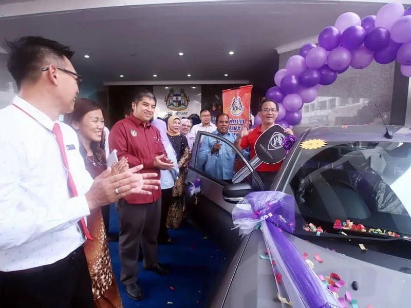 Yeoh with his prize of a Proton Saga 1.3MT
