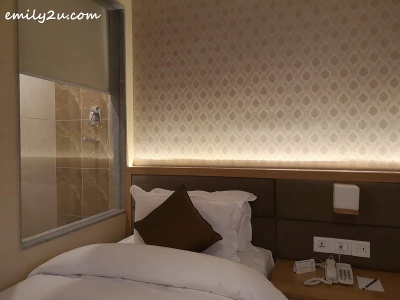 glass panel between guest room and bathroom