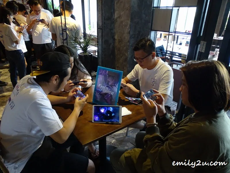  guests at the event playing the latest mobile games