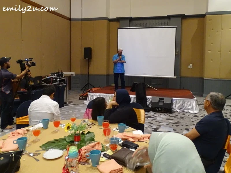 Dato' Roshidi entertains guests with a karaoke track
