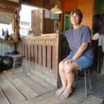 at the counter of a shop that buys rubber in Lenggong