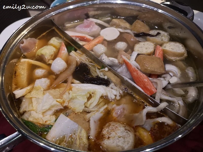 Saranghae Kimchi Steamboat with kimchi soup base on left and chicken soup on right