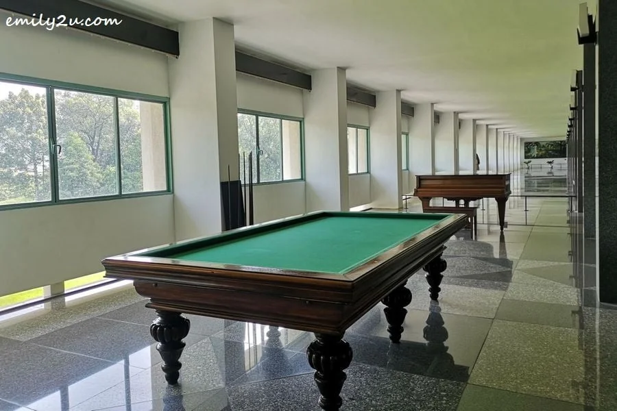 billiards table and grand piano