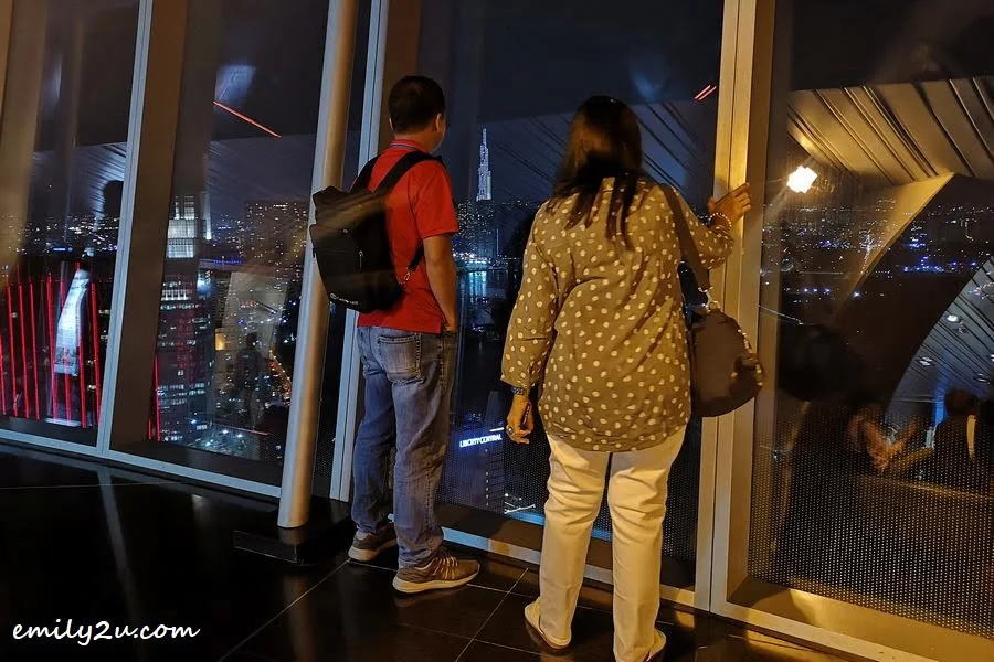 two tourists admire Landmark 81, Vietnam's tallest building