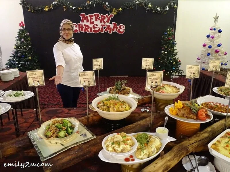 Manager Mariana Abdul Hamid presents Christmas Eve buffet spread at Tower Regency Hotel