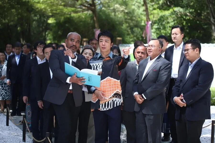 Fukuoka Mayor Takashima Soichiro (centre) is shown the layout of the Japanese Garden