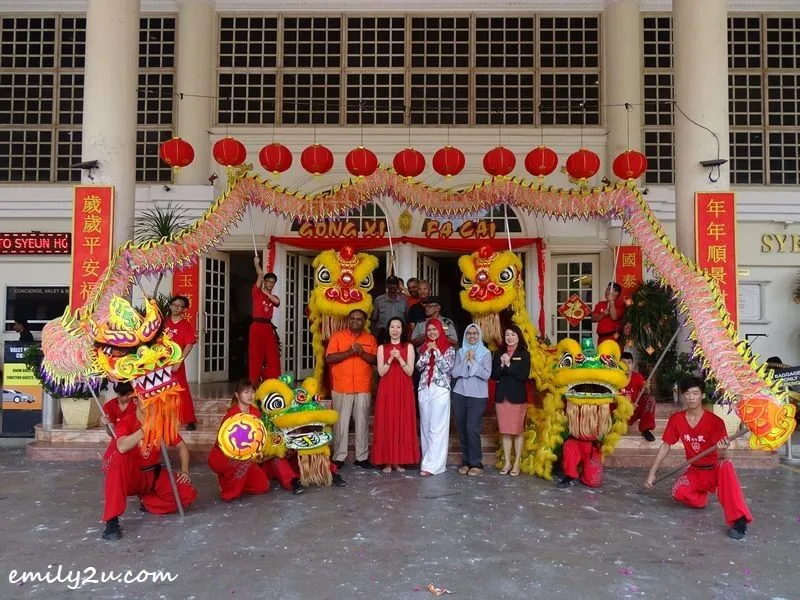 management and staff of Syeun Hotel Ipoh pose with the dragon and lions