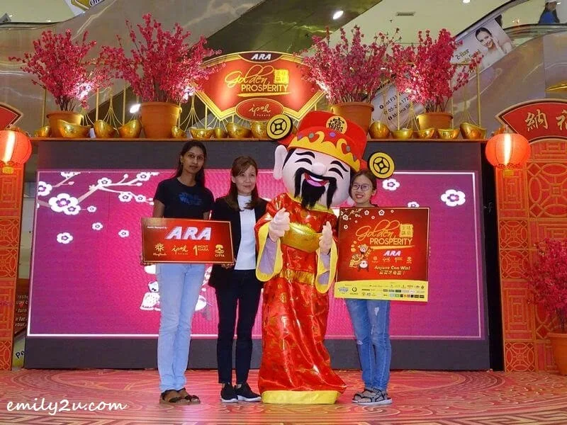 on stage with the God of Prosperity