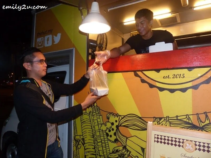 making a purchase from one of the food trucks in Ipoh
