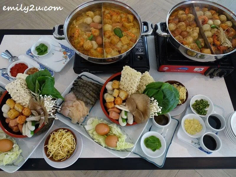 steamboat in action with choice of four soup bases: Penang White Curry, Penang Hokkien, Laksa & Chick Kut Teh